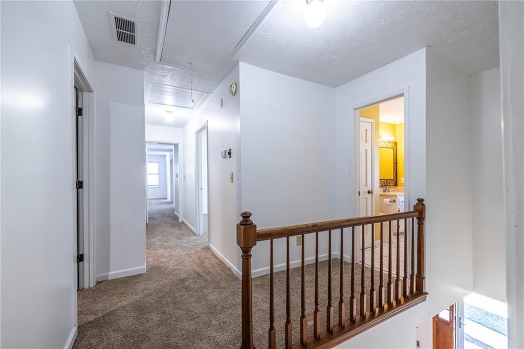 1465 Pounds Road Southwest Lilburn, GA 30047 - Photo 24 of 30 a view of a hallway with a window