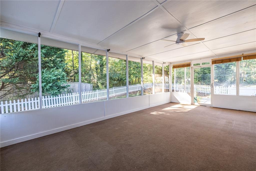 1465 Pounds Road Southwest Lilburn, GA 30047 - Photo 25 of 30 a view of a room with sliding glass door and mountain view