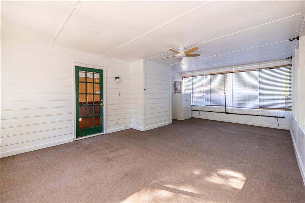 1465 Pounds Road Southwest Lilburn, GA 30047 - Photo 26 of 30 an empty room with windows