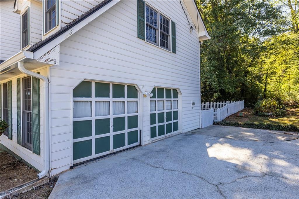 1465 Pounds Road Southwest Lilburn, GA 30047 - Photo 30 of 30 a view of empty room with windows