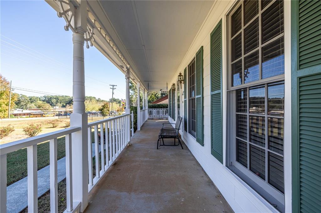 1465 Pounds Road Southwest Lilburn, GA 30047 - Photo 3 of 30 a view of balcony with floor to ceiling window with wooden floor