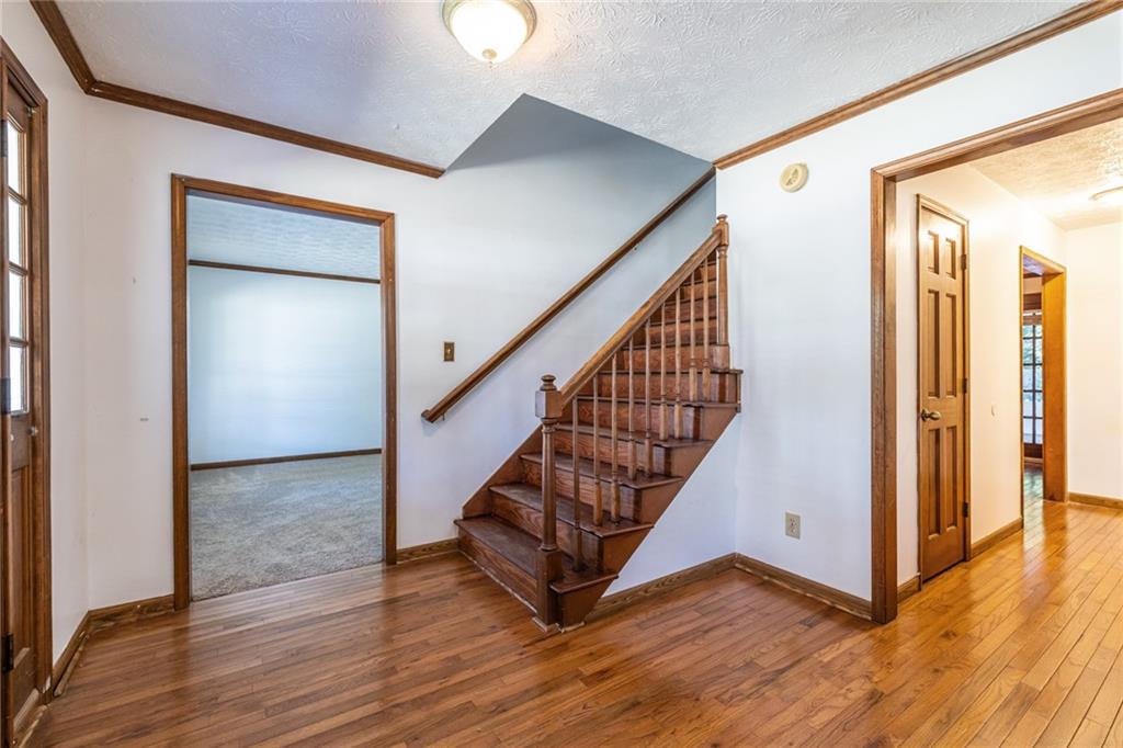 1465 Pounds Road Southwest Lilburn, GA 30047 - Photo 4 of 30 a view of entryway with wooden floor
