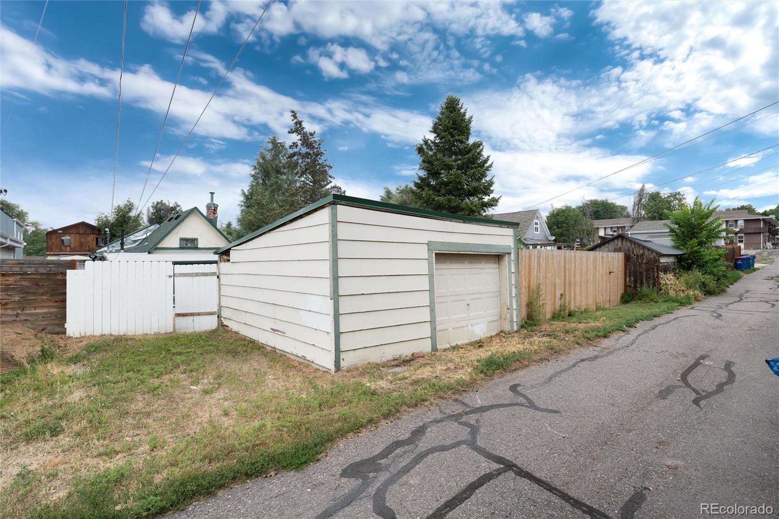 2568 Eaton Street Edgewater, CO 80214 - Photo 23 of 24 a view of a white house with a yard