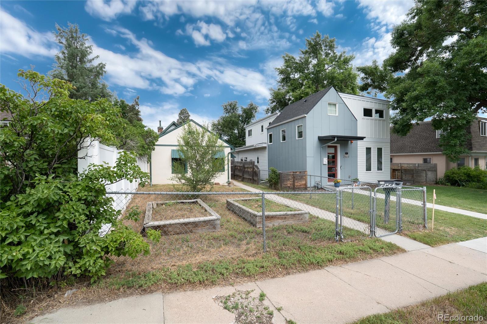 2568 Eaton Street Edgewater, CO 80214 - Photo 5 of 24 a view of a house with backyard and sitting area