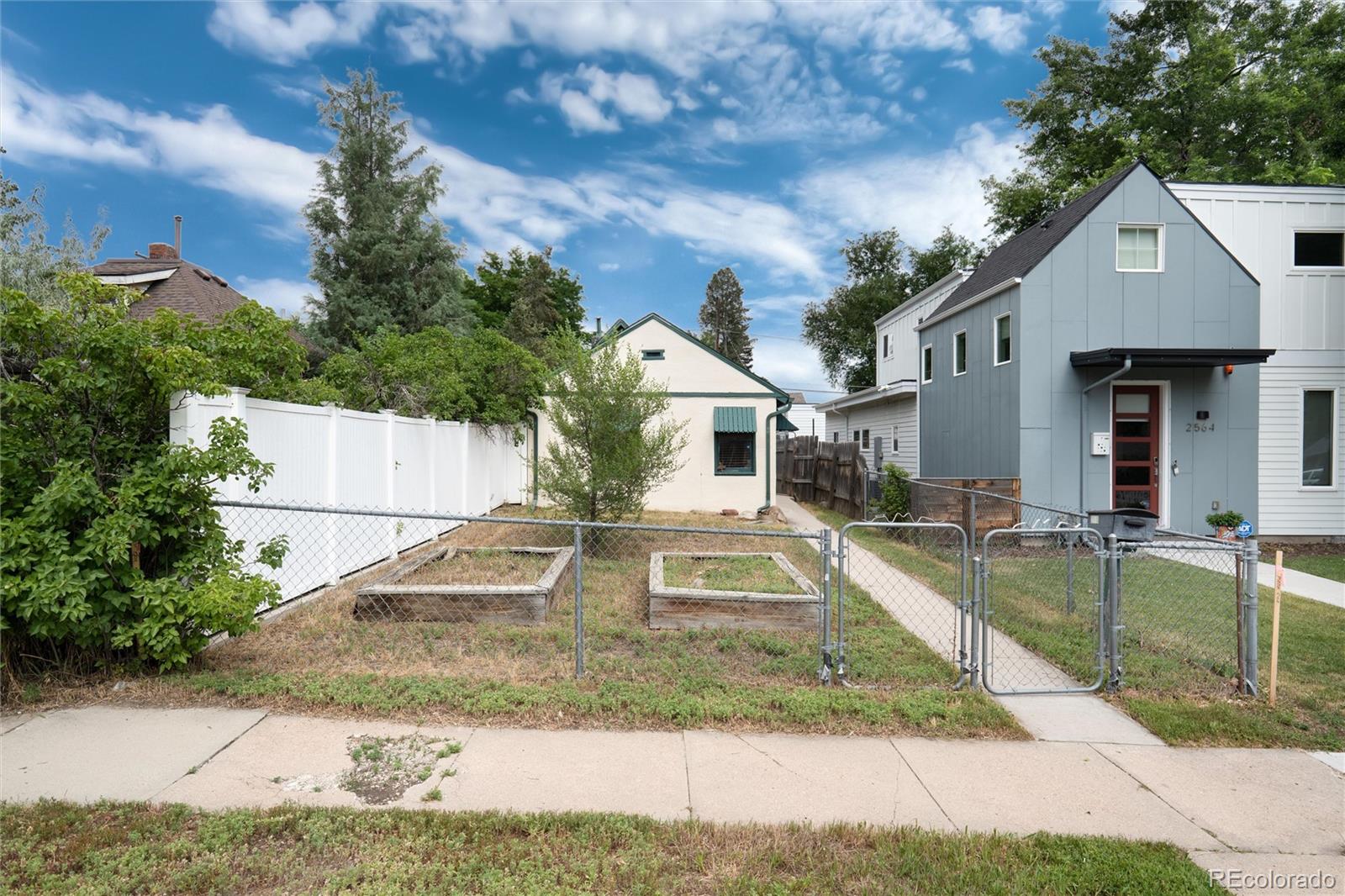 2568 Eaton Street Edgewater, CO 80214 - Photo 6 of 24 a front view of a house with a yard