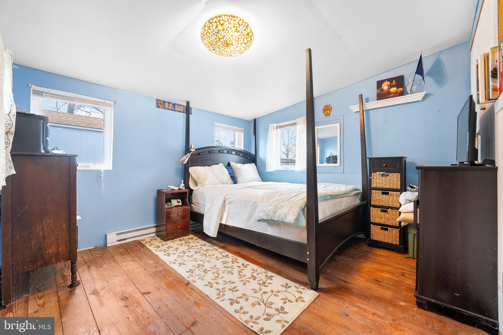 17 Valley Road Earleville, MD 21919 - Photo 8 of 23 a bedroom with a bed and a table in it
