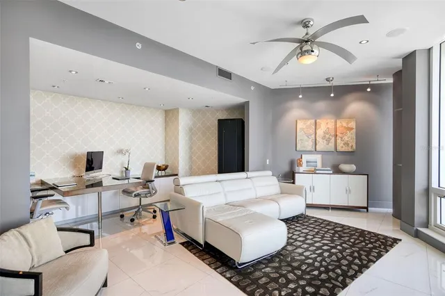 a view of balcony with chairs and wooden floor