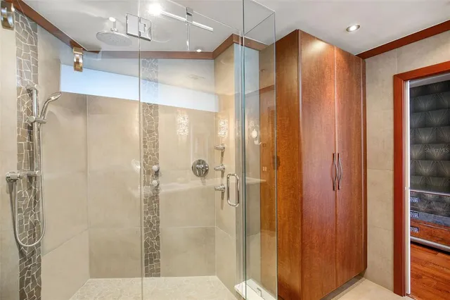 a view of a bathroom with a tub and shower