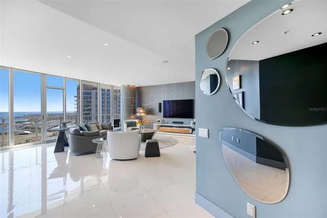 a living room with couches and a flat screen tv