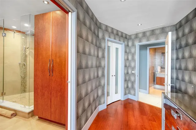 a bathroom with a double vanity sink and a mirror