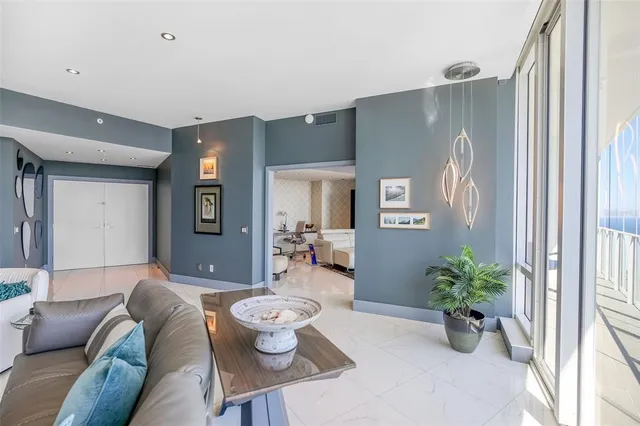 a kitchen with stainless steel appliances granite countertop a sink and a refrigerator