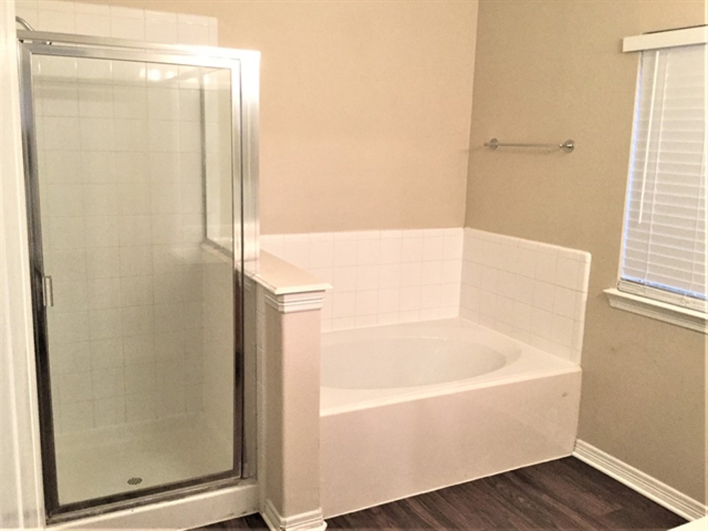 2213 Perkins Crossing Drive Conroe, TX 77304 - Photo 12 of 19 a bathroom with a bathtub