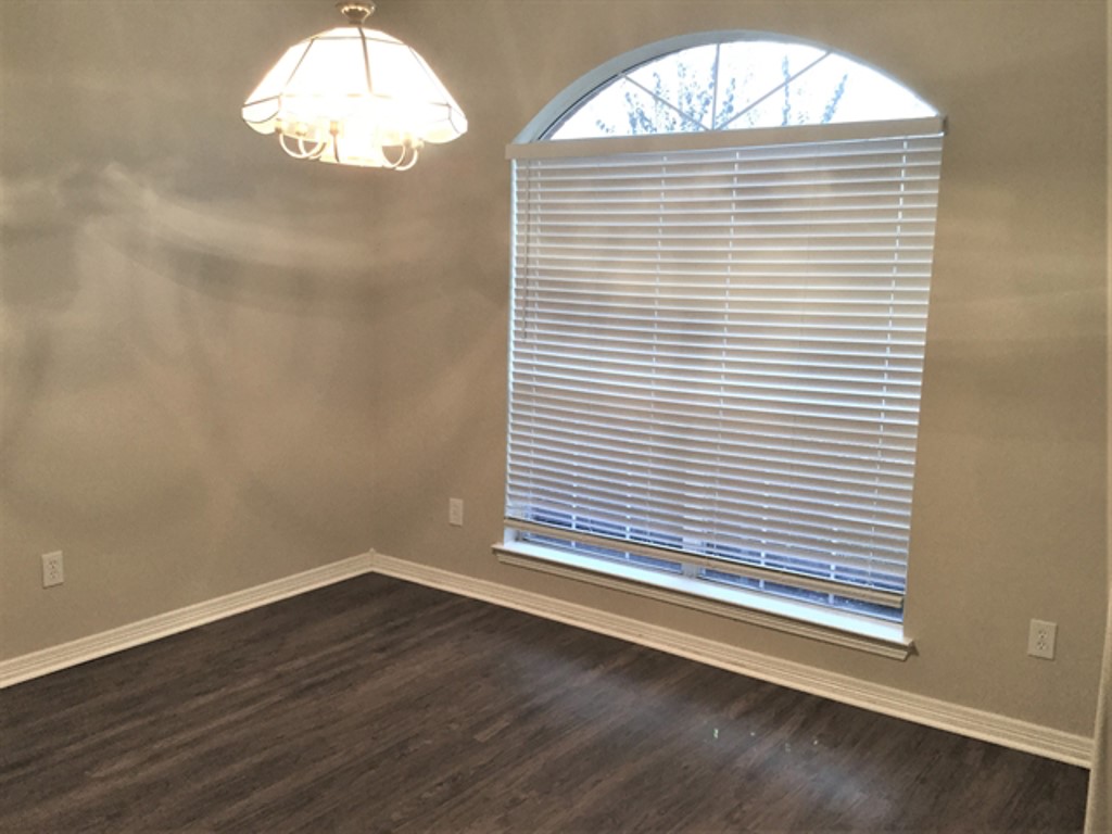 2213 Perkins Crossing Drive Conroe, TX 77304 - Photo 6 of 19 an empty room with wooden floor