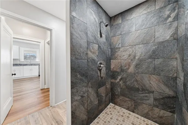 a bathroom with a small shower