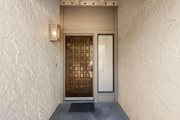 a view of front door with wooden floor