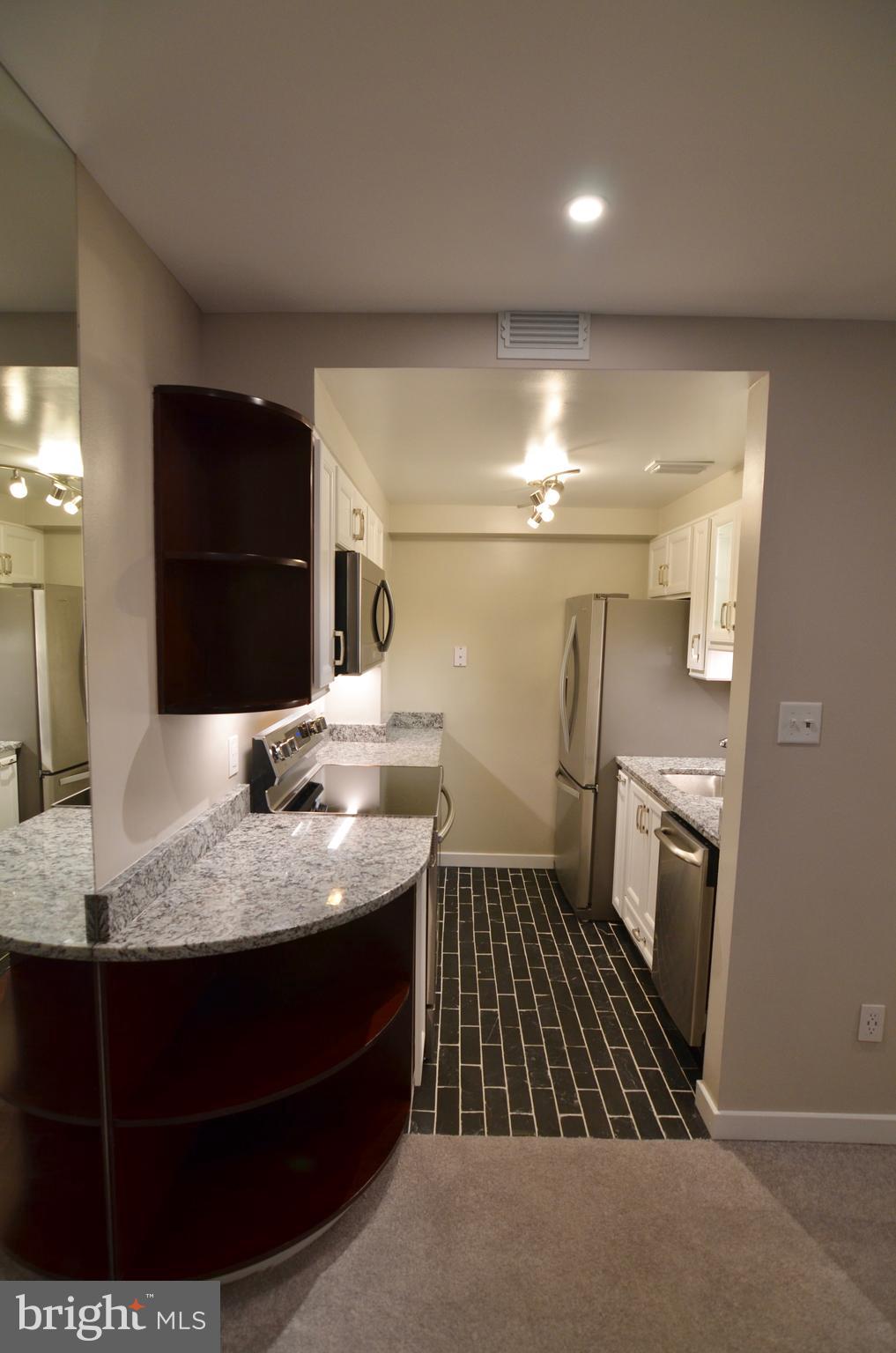 2114 N Street Northwest, Unit 2 Washington, DC 20037 - Photo 3 of 24 a bathroom with a sink and a mirror