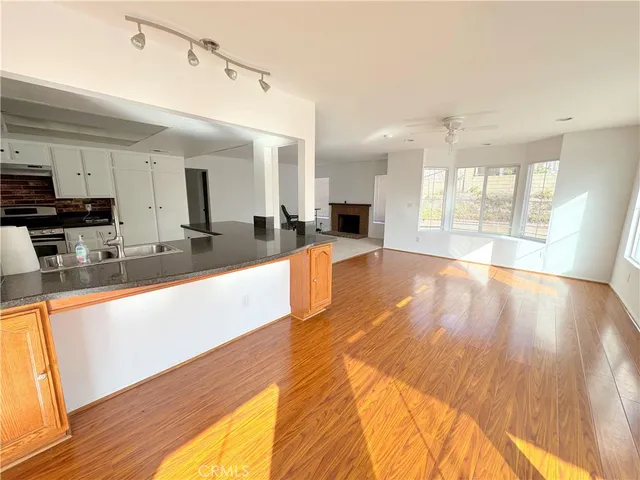 a view of a kitchen with a large window