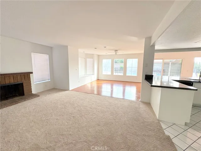 a kitchen with a refrigerator sink and cabinets