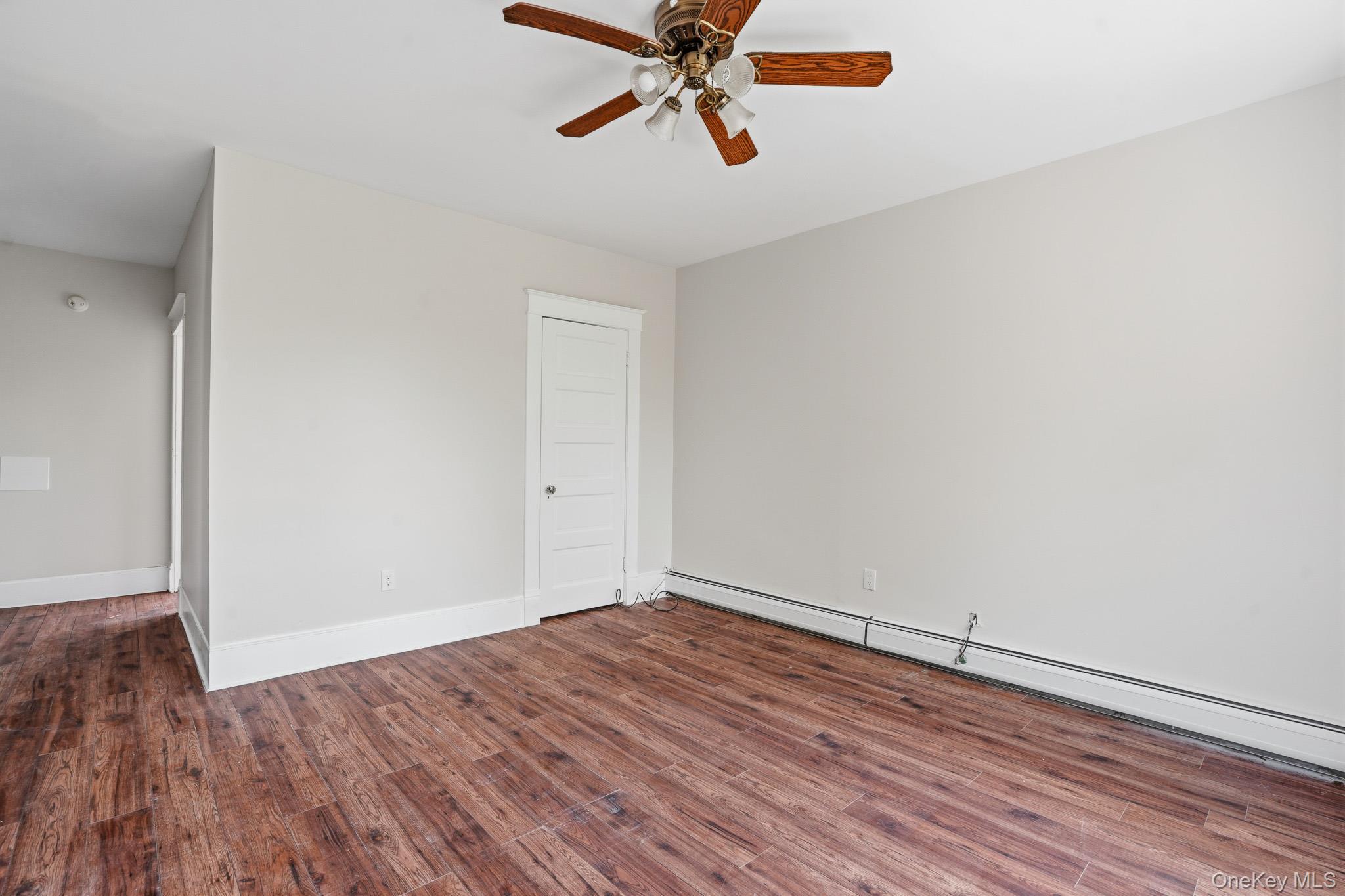 65 North Clinton Street Poughkeepsie, NY 12601 - Photo 28 of 43 an empty room with wooden floor and windows