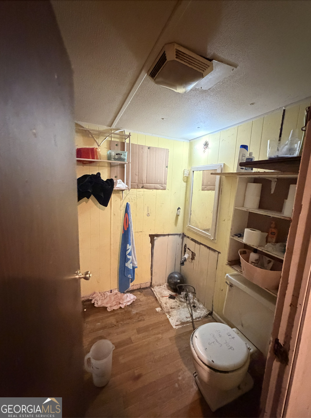 258 Persimmon Street Toccoa, GA 30577 - Photo 14 of 25 a bathroom with a sink toilet and shower
