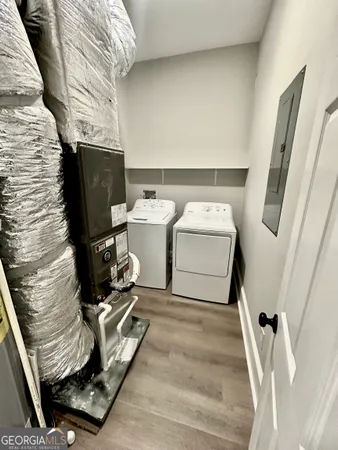 a utility room with dryer and washer