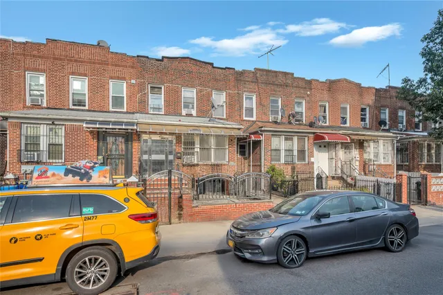 a car parked in front of a house