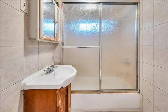 a bathroom with a sink and mirror