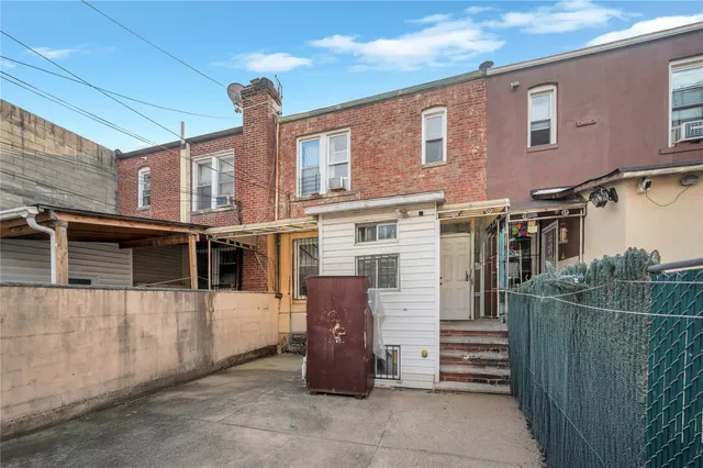 a front view of a house with parking area