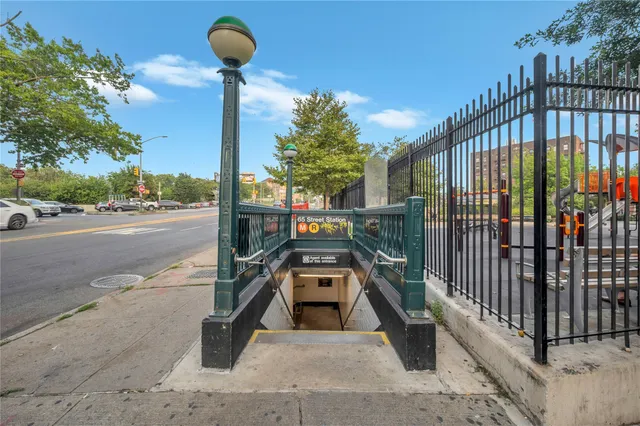 a view of a balcony with floor to ceiling windows