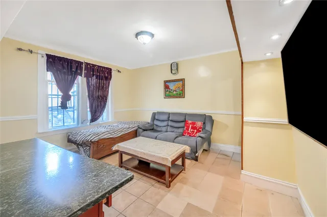a living room with furniture and window