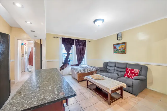 a living room with furniture and a table