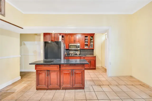 a hallway with a table and a mirror