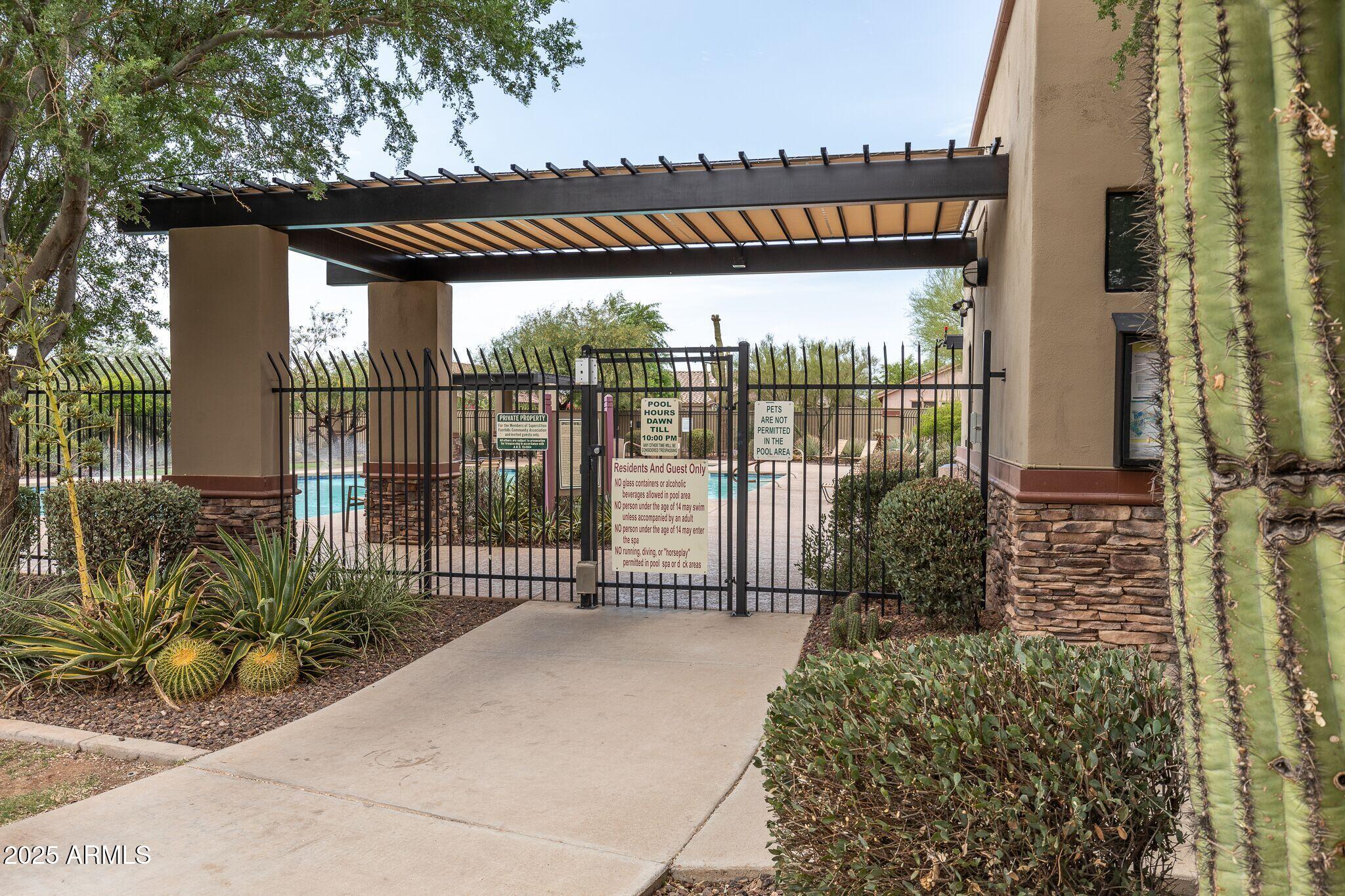 7119 East San Cristobal Way Gold Canyon, AZ 85118 - Photo 53 of 71 07_Pool Entrance_Superstition Foothills