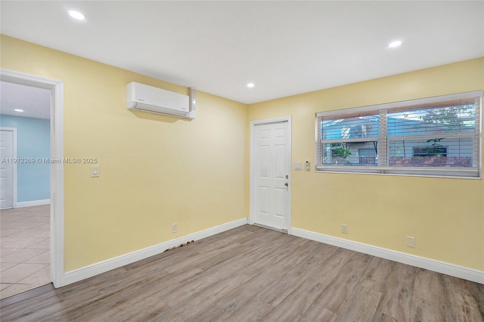 720 Southeast 15th Street, Unit 1 Fort Lauderdale, FL 33316 - Photo 15 of 38 a view of a room with wooden floor and a ceiling fan