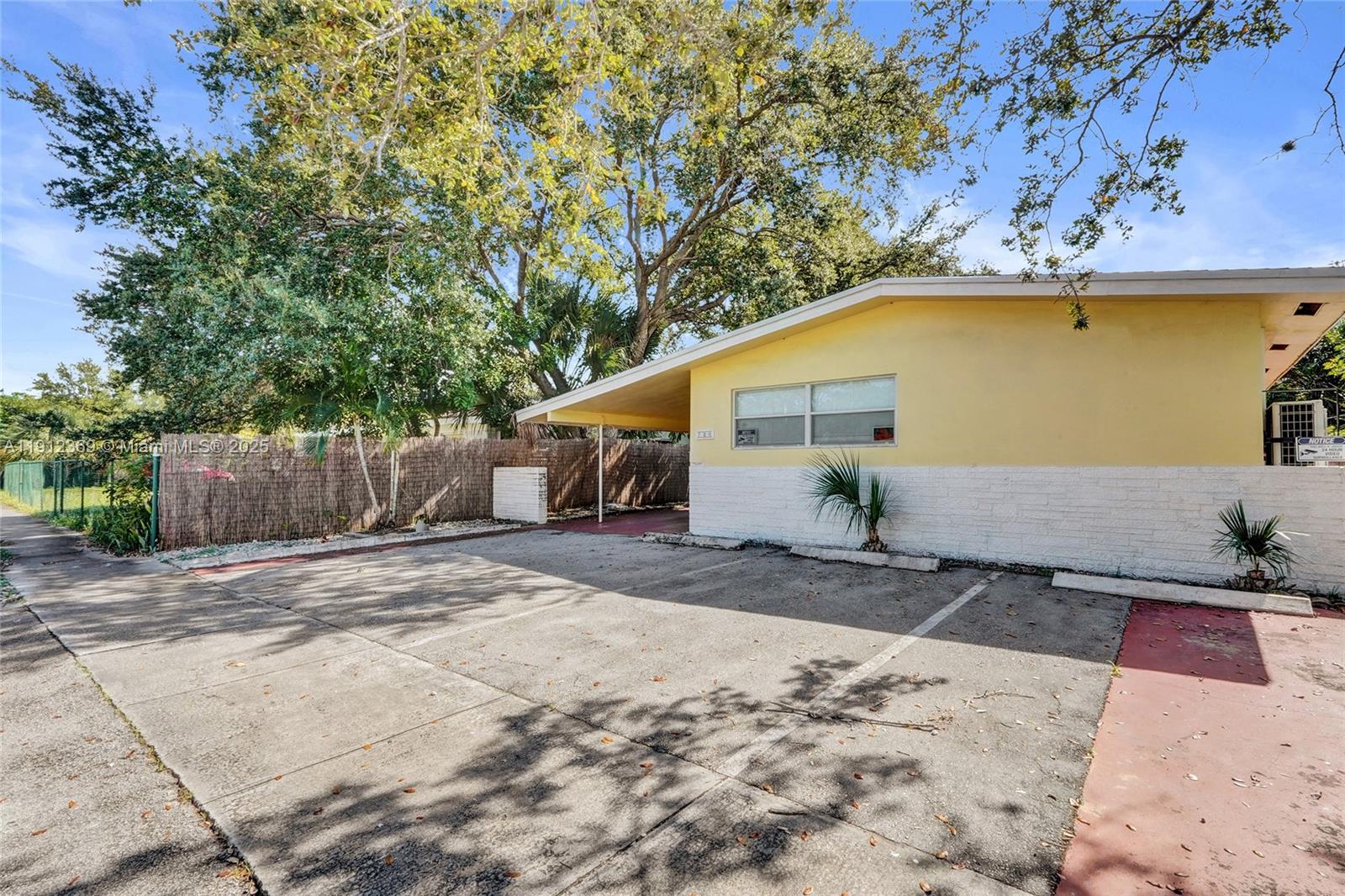 720 Southeast 15th Street, Unit 1 Fort Lauderdale, FL 33316 - Photo 2 of 38 a front view of a house with a yard and garage