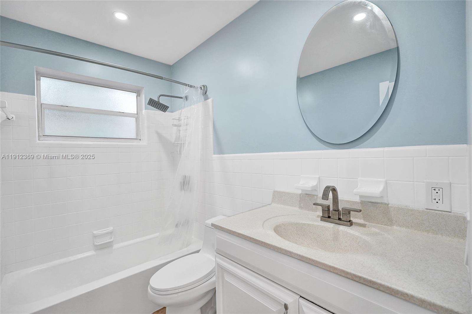 720 Southeast 15th Street, Unit 1 Fort Lauderdale, FL 33316 - Photo 21 of 38 a bathroom with a sink a toilet and a mirror