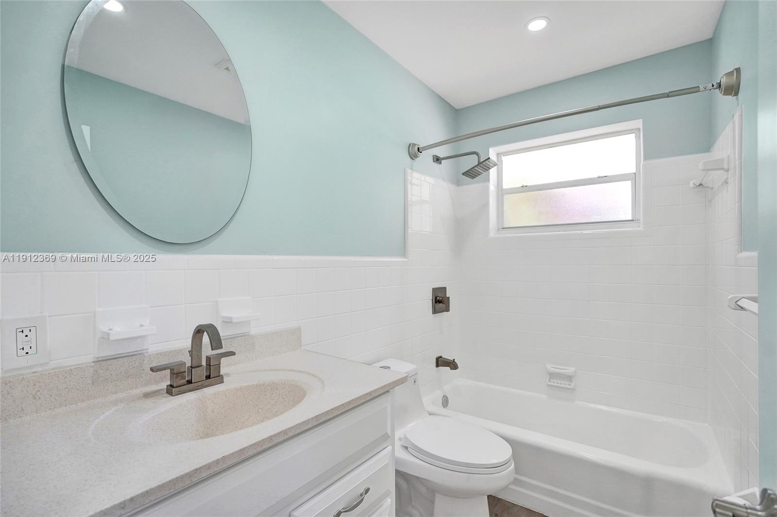 720 Southeast 15th Street, Unit 1 Fort Lauderdale, FL 33316 - Photo 25 of 38 a bathroom with a sink a toilet and a mirror