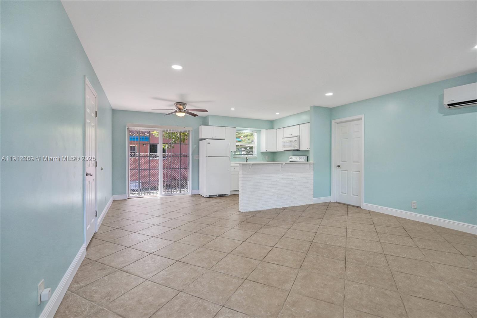 720 Southeast 15th Street, Unit 1 Fort Lauderdale, FL 33316 - Photo 7 of 38 a view of a kitchen with a refrigerator a sink and dishwasher cabinets