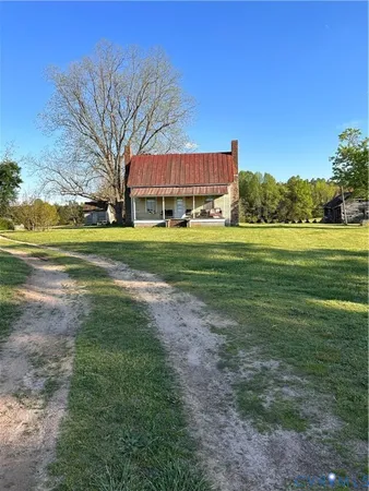 a view of a big yard with a house