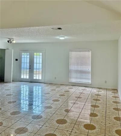 a view of an empty room and window