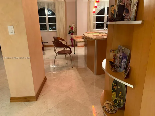 a view of a hallway with seating area