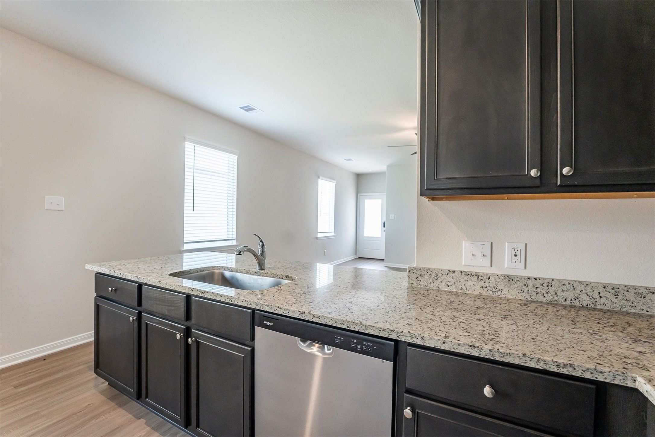 15419 Maple Ter Drive Conroe, TX 77303 - Photo 12 of 32 a kitchen with granite countertop cabinets sink and window