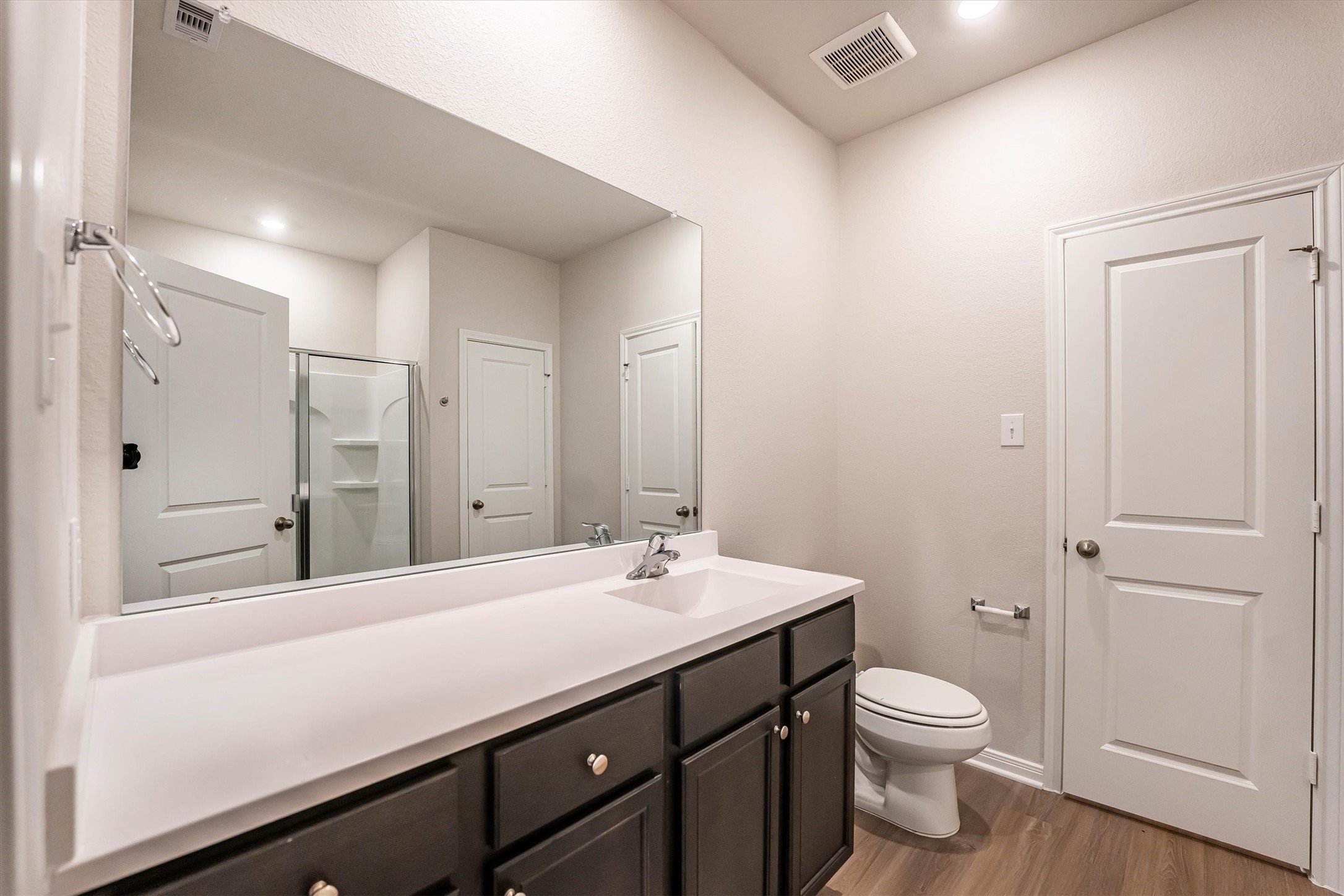 15419 Maple Ter Drive Conroe, TX 77303 - Photo 18 of 32 a bathroom with a sink a toilet and shower