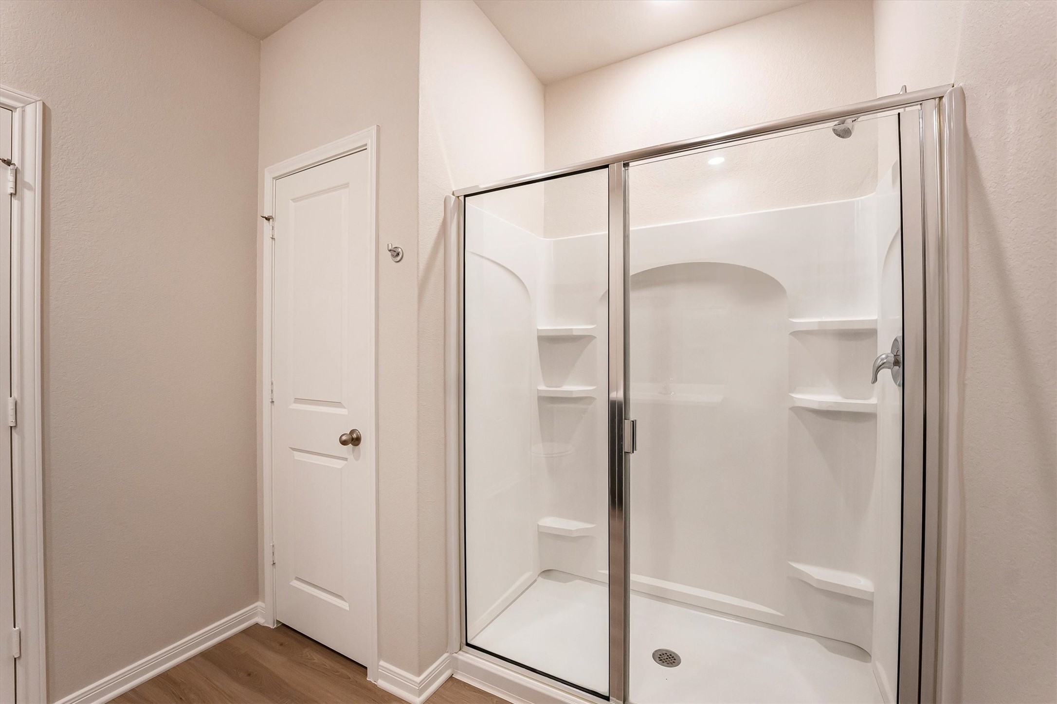 15419 Maple Ter Drive Conroe, TX 77303 - Photo 19 of 32 a bathroom with a glass shower door