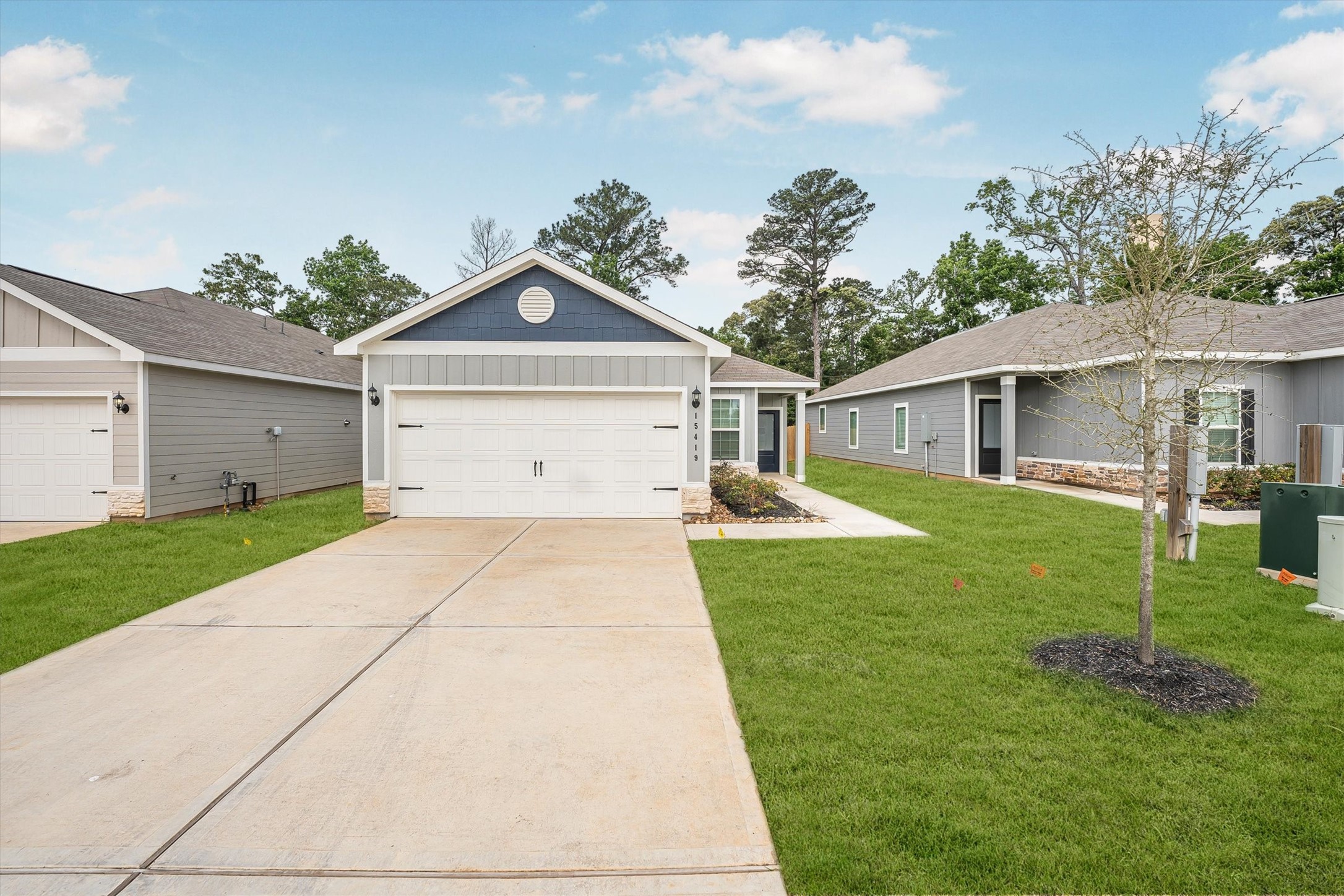 15419 Maple Ter Drive Conroe, TX 77303 - Photo 2 of 32 a front view of a house with a yard and trees