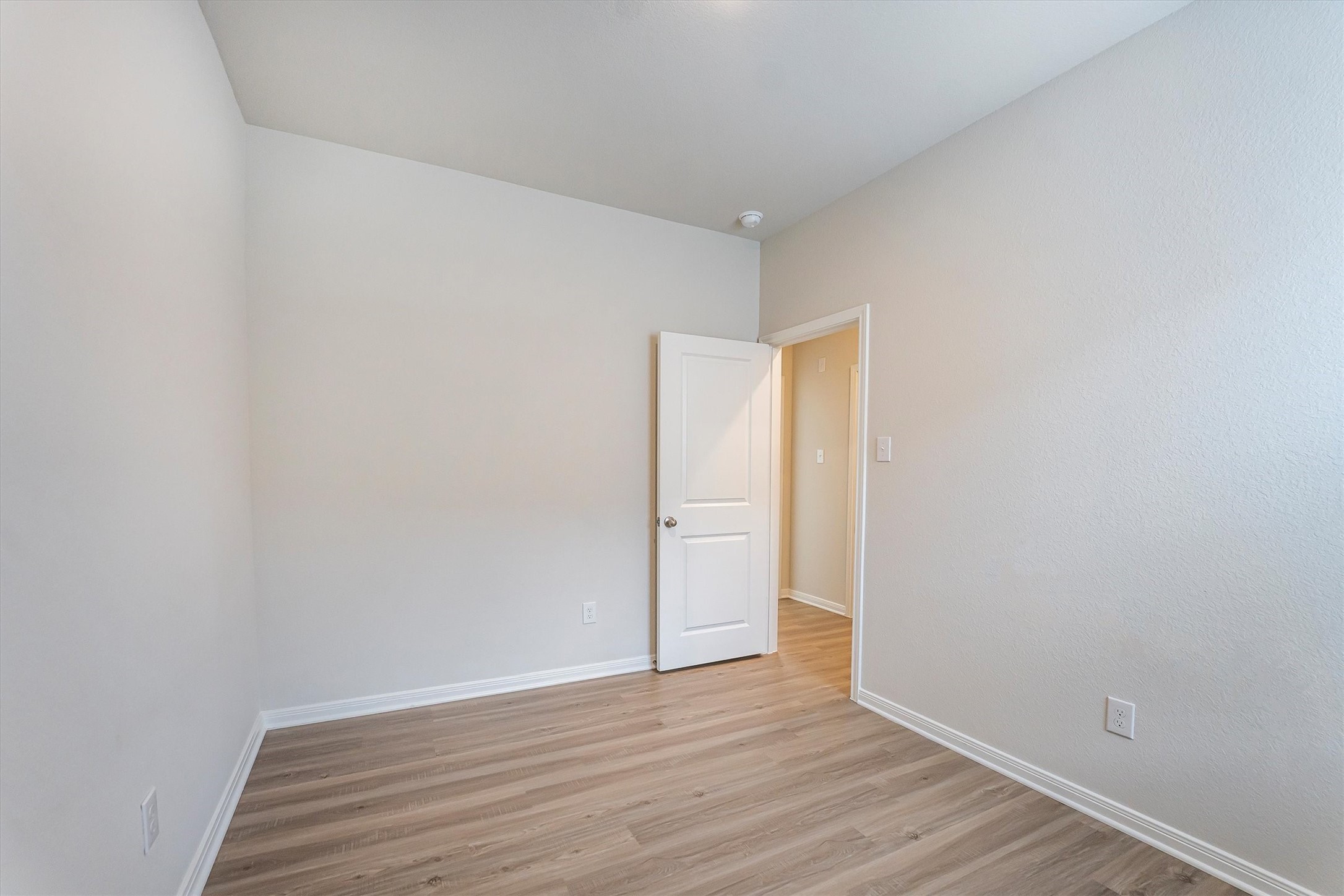 15419 Maple Ter Drive Conroe, TX 77303 - Photo 22 of 32 a view of an empty room with wooden floor and closet