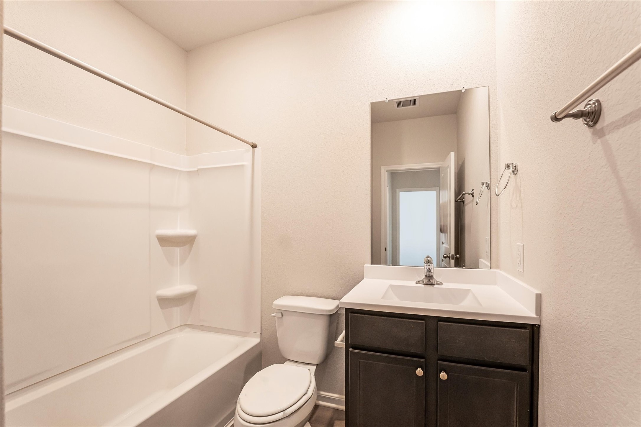 15419 Maple Ter Drive Conroe, TX 77303 - Photo 24 of 32 a bathroom with a sink toilet vanity and shower