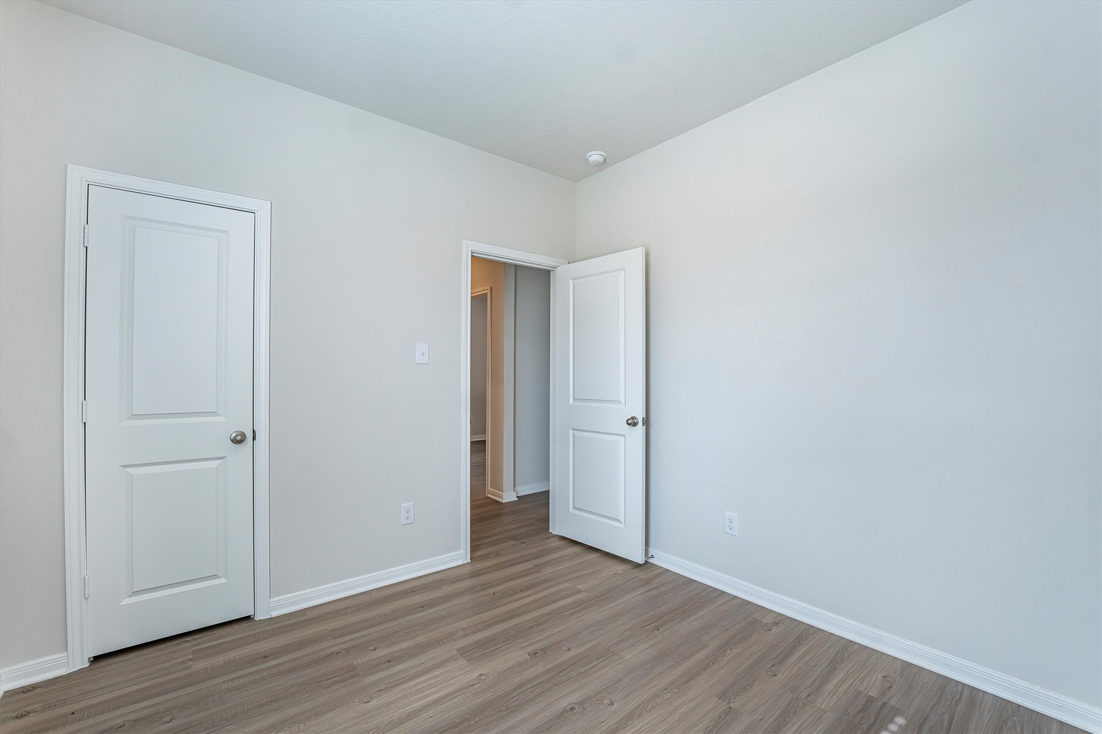 15419 Maple Ter Drive Conroe, TX 77303 - Photo 25 of 32 a view of an empty room and wooden floor