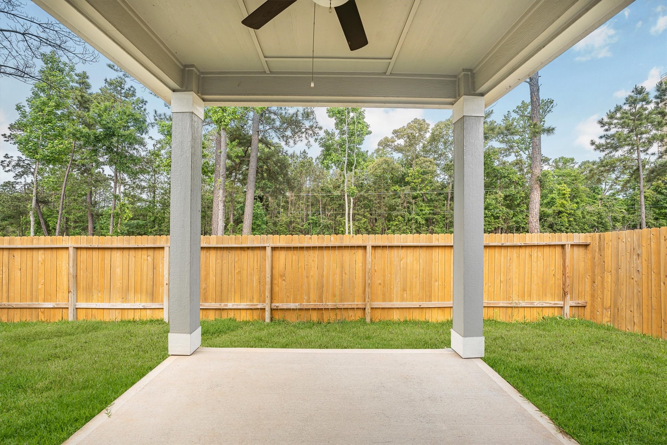 15419 Maple Ter Drive Conroe, TX 77303 - Photo 32 of 32 a view of a porch with a garden