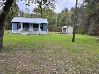 11823 FM 355, Unit A Trinity, TX 75862 - Photo 1 of 12 a front view of a house with a yard